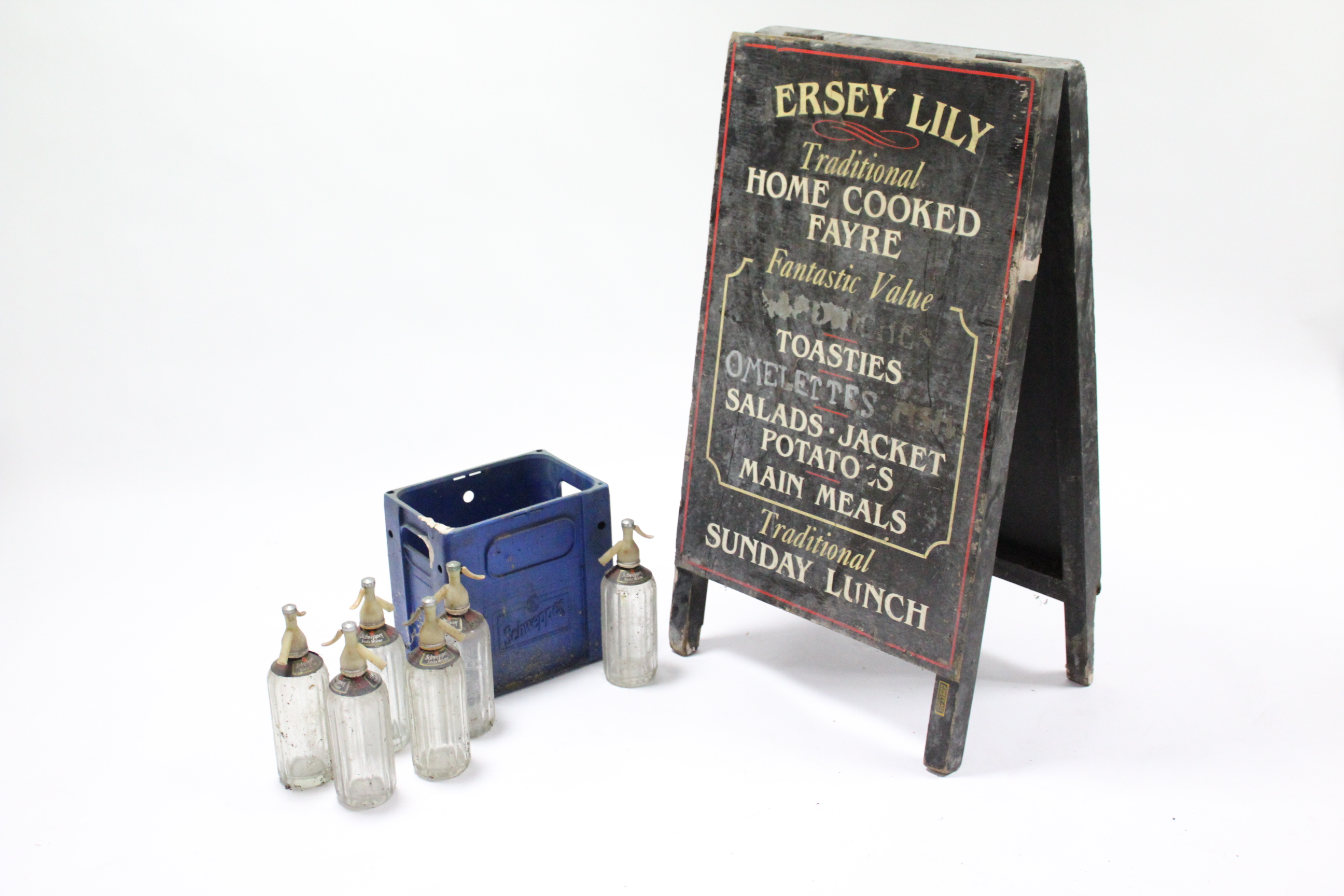 Six Schweppes glass soda syphon bottles; a Schweppes blue plastic six-division crate; & three