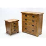 A light oak chest fitted two short & three long graduated drawers with iron swing handles, 36¼” wide