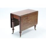 A 19th century mahogany drop-leaf dining table with moulded edge & rounded corners to the
