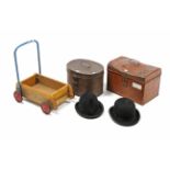 A black felt bowler hat; a similar trilby hat; two grained tin hat boxes; & a Tri-ang baby walker.