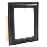 A rectangular wall mirror in simulated tortoiseshell frame, 28½” x 23¾”; together with a brass