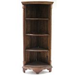 A teak tall standing four-tier open corner bookcase with spiral-twist pilasters, & on bracket