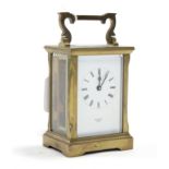 A brass cased carriage clock, the white enamel dial signed “MALLORY, BATH”, 4½” high.