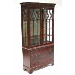 A reproduction mahogany tall china display cabinet, with two adjustable shelves enclosed by pair