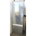A Bosch integrated fridge-freezer in stainless steel case, 21” wide x 70” high, w.o.