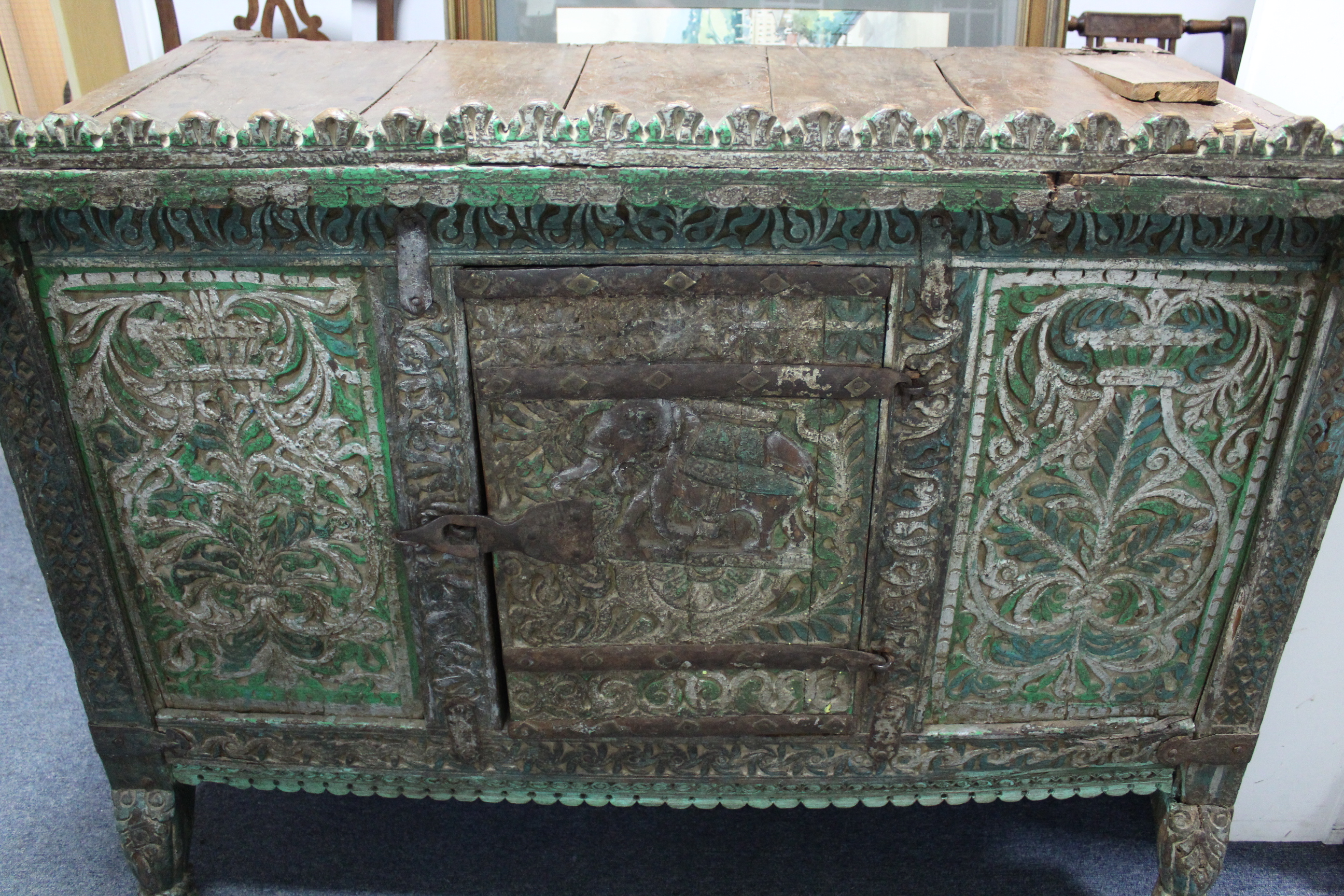 AN ANTIQUE INDIAN GREEN & GREY PAINTED & CARVED HARDWOOD LOW CABINET, ENCLOSED BY CARVED PANEL DOOR, - Image 2 of 4