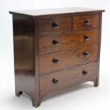 A 19th century stained pine chest fitted two short & three long graduated drawers with turned knob