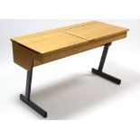 A beech “duet” school desk on black metal-finish supports, 44” wide.