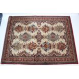 A Delphi New Zealand wool small carpet of cream & crimson ground, with repeating multi-coloured