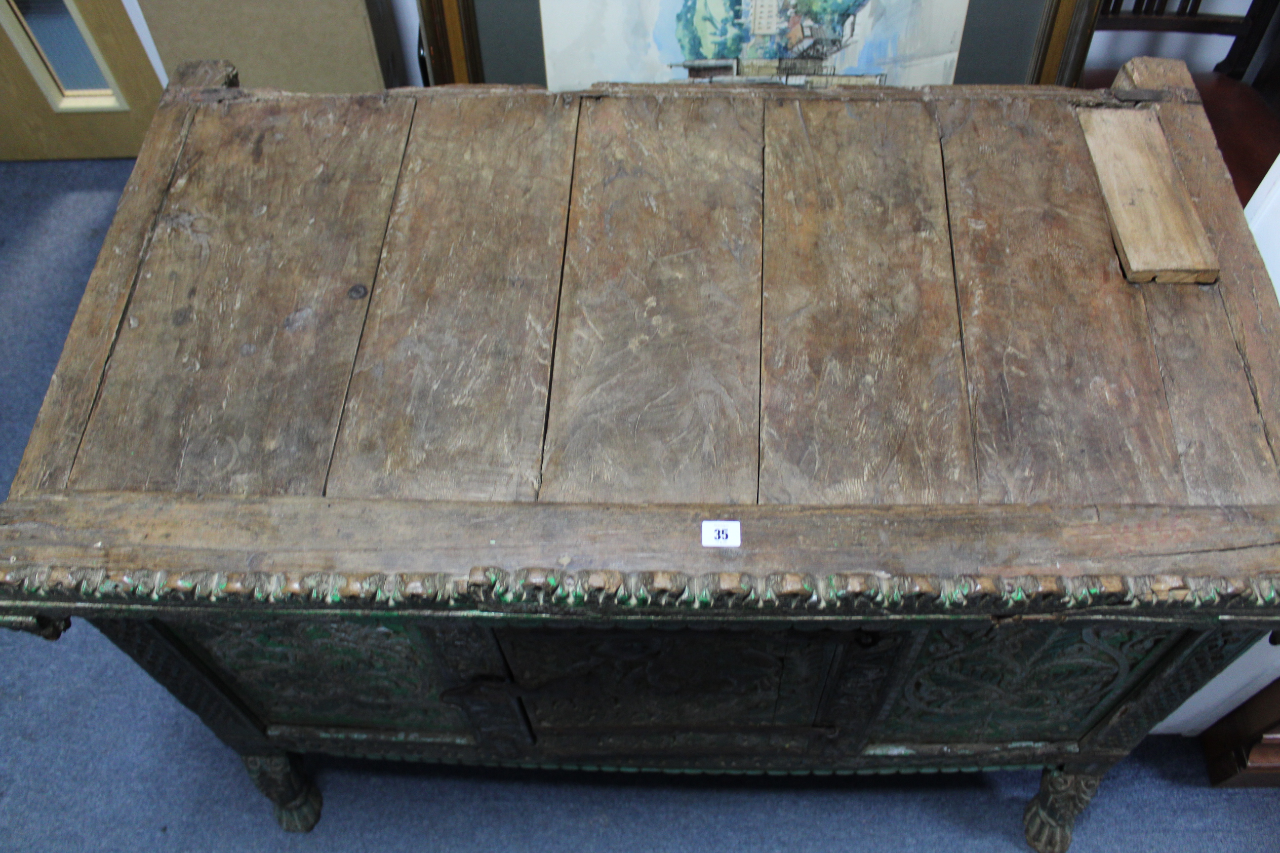 AN ANTIQUE INDIAN GREEN & GREY PAINTED & CARVED HARDWOOD LOW CABINET, ENCLOSED BY CARVED PANEL DOOR, - Image 4 of 4