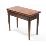 A Georgian mahogany tea table with rectangular fold-over top, & on chamfered square tapered legs,