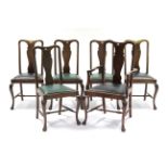 A set of six 1930’s mahogany dining chairs in the Queen-Anne style (including one carver chair) each