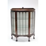 A mid-20th century mahogany demi-lune china display cabinet, fitted two plate-glass shelves enclosed
