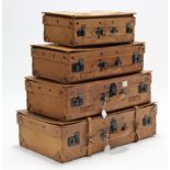 A set of four Giovanni “National Explorer” pigskin suitcases.