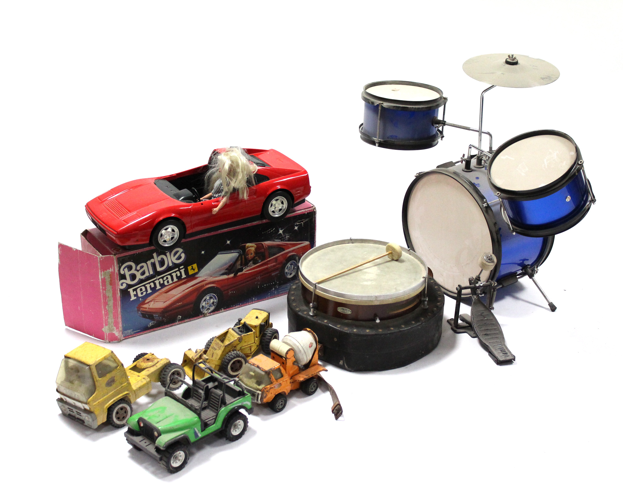 A Mattel toy “Barbie’s Ferrari”, boxed; a child’s four-piece drum kit; six Tonka toys; & various