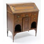 A late Victorian walnut small bureau, with fitted interior enclosed by fall-front above an