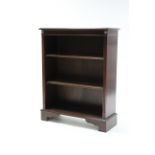 A reproduction inlaid-mahogany small standing open bookcase with two adjustable shelves, & on