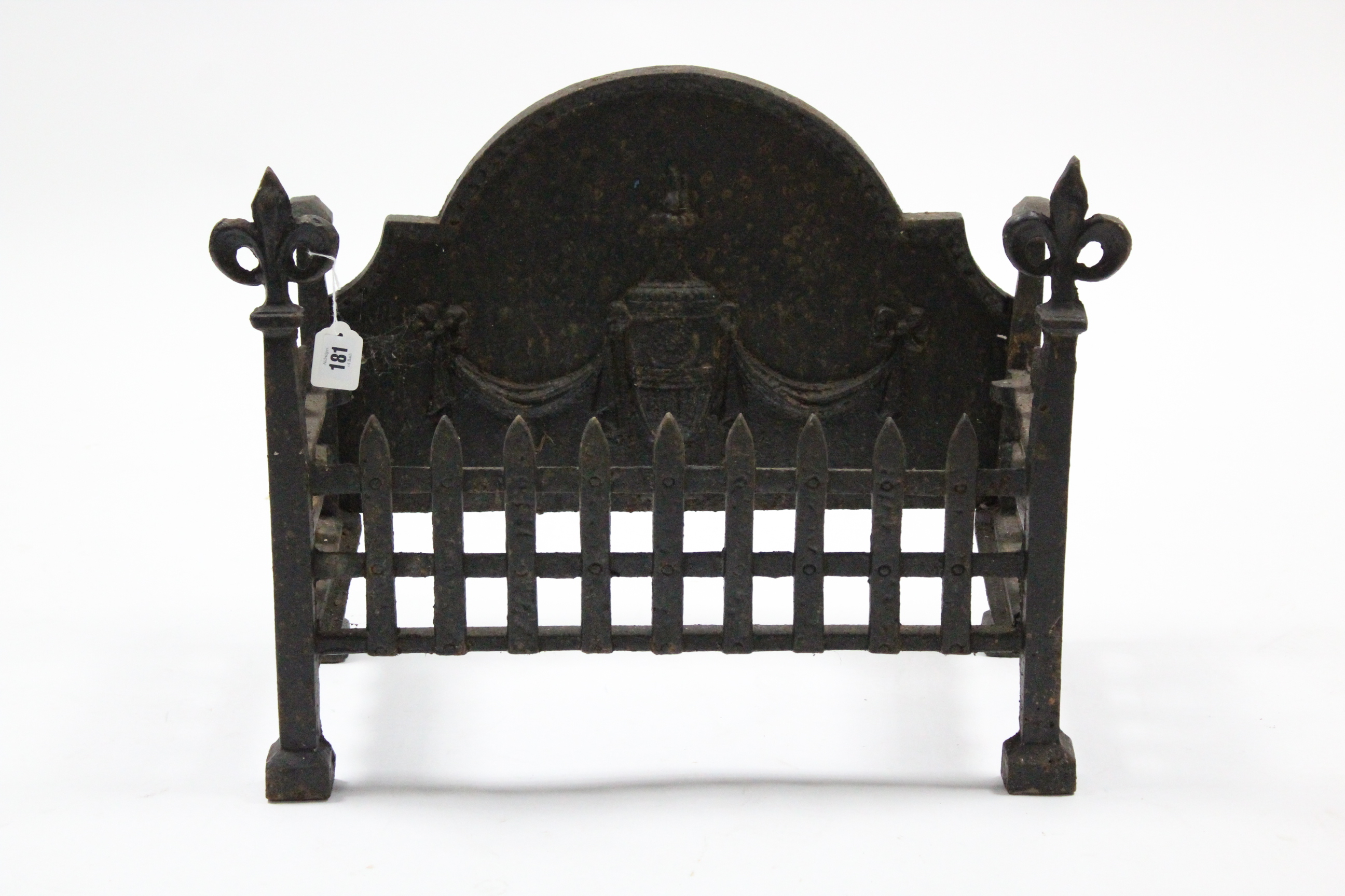 A cast-iron fire grate with raised urn design to the rounded back, 24” wide x 18” high.