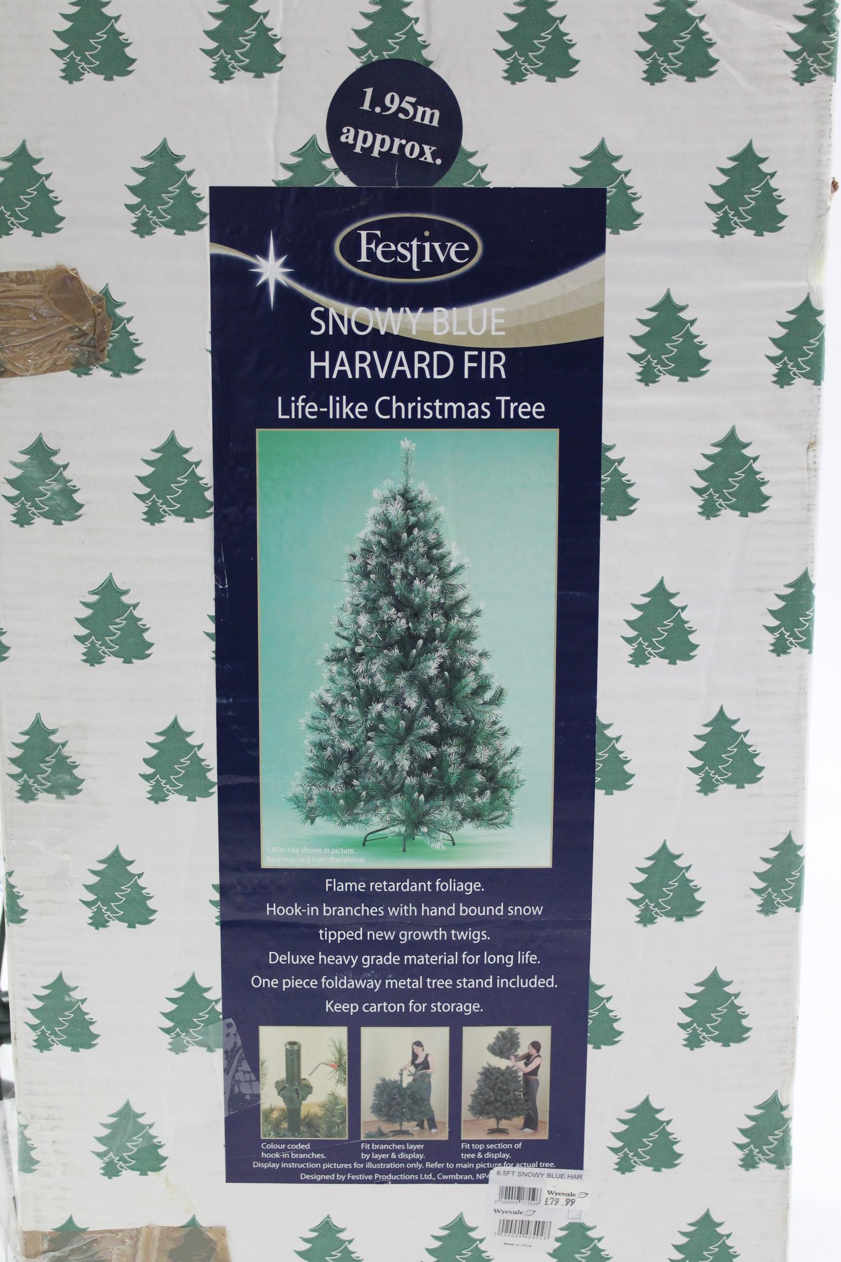 A festive “Snowy Blue Harvard Fir” 1.95m artificial Christmas tree, boxed.