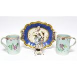 An early 19th century English shaped oval two-handled dish with blue, peach, & gilt border, the