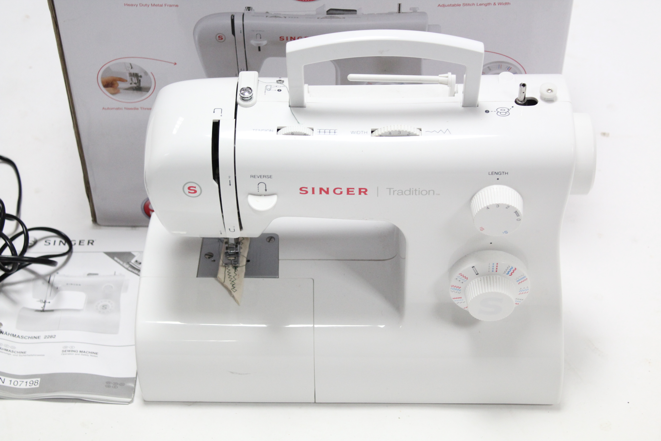 A Singer “Tradition 2282” electric sewing machine, boxed, w.o.