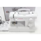 A Singer “Tradition 2282” electric sewing machine, boxed, w.o.