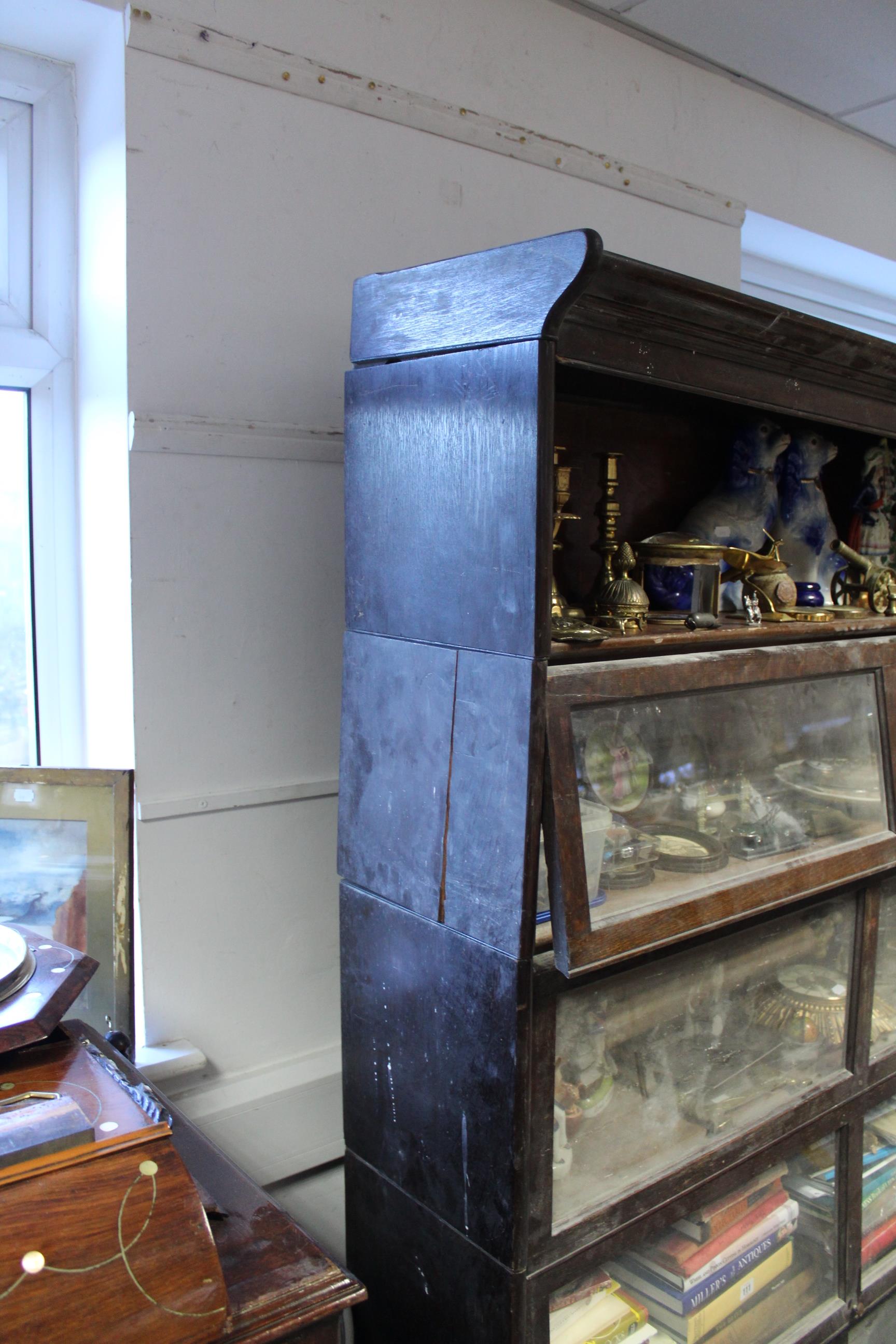 A Globe Wernicke oak five-tier sectional bookcase, each tier enclosed by glazed door, & on plinth - Image 2 of 3