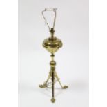 A Victorian brass oil table lamp (converted to electricity) on triform base, 30” high.