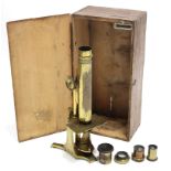 An early 20th century brass monocular microscope by Smith & Beck of London (No. 273), 14½” high,