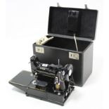 A Singer electric sewing machine (Model No. 222K), with instruction booklet, cased, w.o.