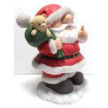 A fibreglass Santa Claus garden ornament, 27" high.