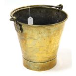 A vintage brass fire bucket stamped” MK”, 11” high.