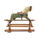 AN EARLY 20th CENTURY DAPPLE GREY PAINTED WOODEN ROCKING HORSE ON PINE TRESTLE BASE, 63” long x