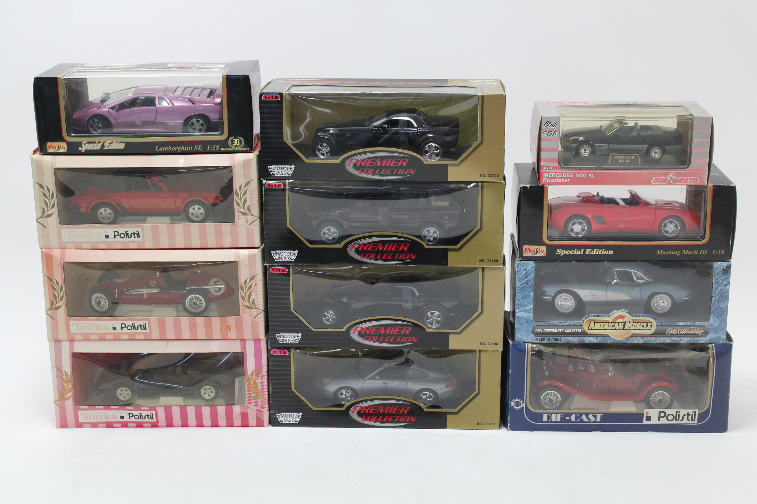 Fourteen various large scale model cars by Maisto, Tonka, & others, each with window box.