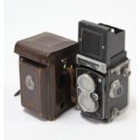 A Rolleiflex “Rollei” box camera; & a Rolleimeter (No. 5605) each with leather case.