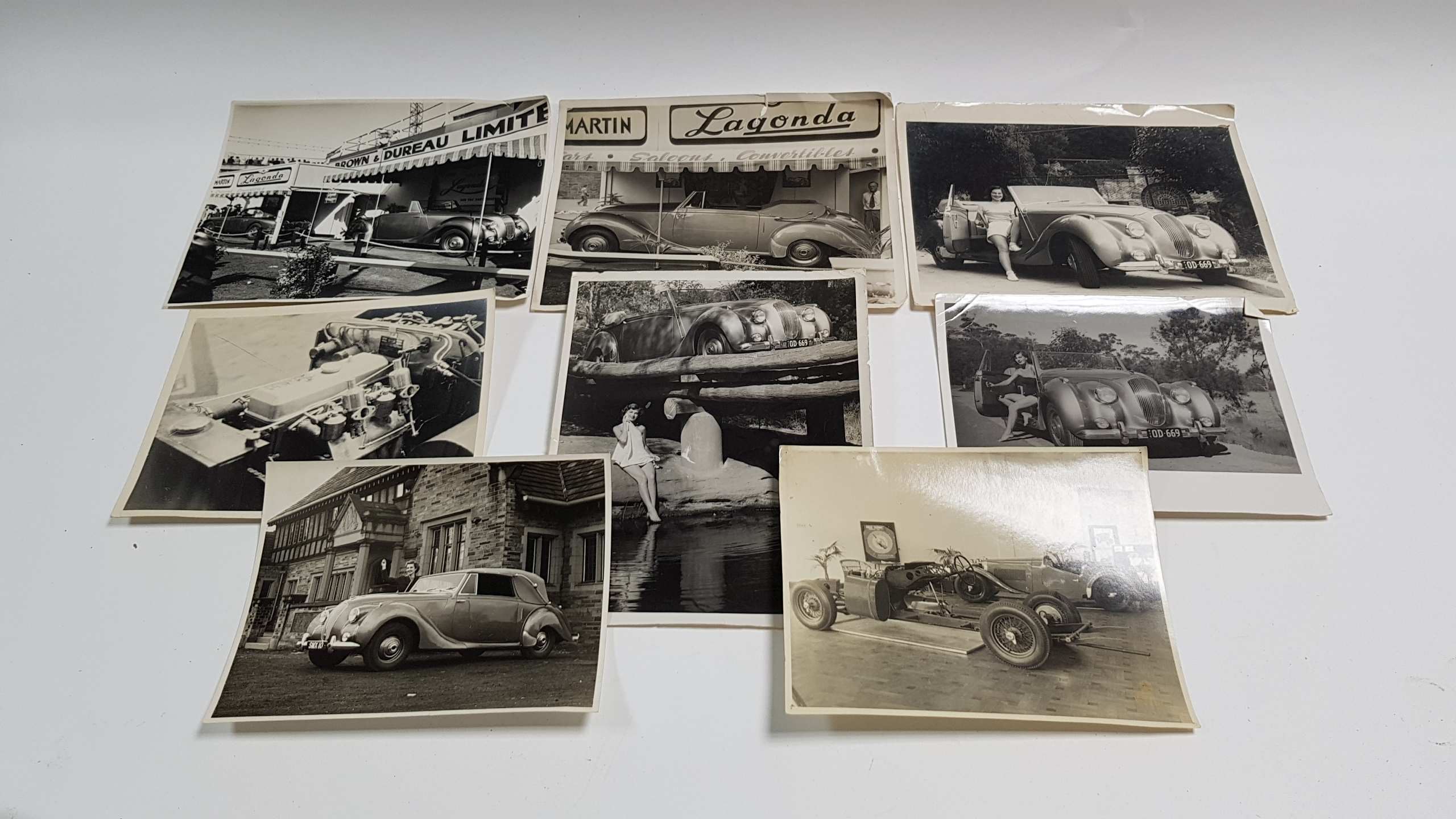 Thirteen mid-20th century photographs of motor cars, loose; an early 20th century autograph album; &