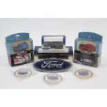 Four various scale model Ford vehicles; together with two other scale models, each in window box;