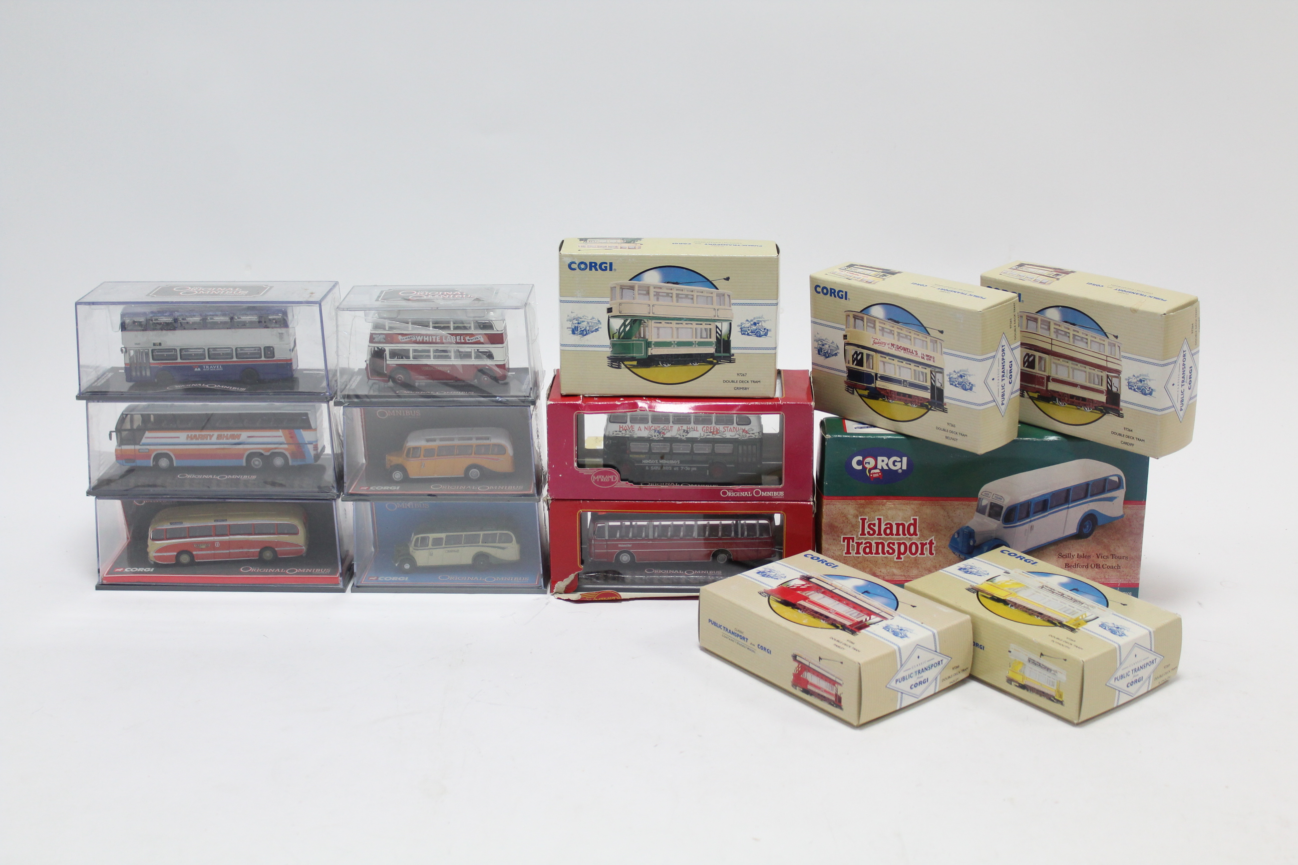 Fourteen various scale model ‘busses & trams, all boxed.