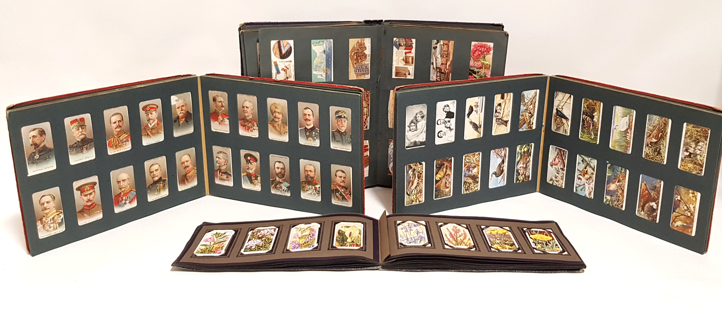 Various cigarette cards by JOHN PLAYER & W. D. & H. O. WILLS, contained in four albums.