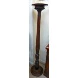 A late Victorian/Edwardian mahogany pedestal torchere, the turned,