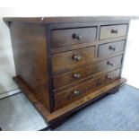 A modern stained beech base cabinet, fitted with six drawers,