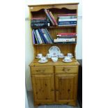 A modern waxed pine dresser, the superstructure with two open shelves,