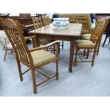 A late Victorian oak wind-out dining table, the top with canted corners, raised on square,