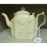 An early 19thC Castleford biscuit coloured pottery oval teapot, featuring a hinged cover,