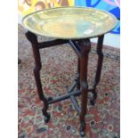 An early 20thC rosewood framed, folding stand, supporting an associated,