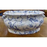 A late Victorian Copeland & Garrett china footbath with a blue and white marble effect finish