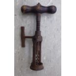 A late 19thC iron, open rack design corkscrew with a side handle,