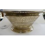 An early 20thC silver coloured metal bowl with a pierced border stamped Sterling 6''dia 11