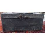 A late 19thC studded black hide covered pine trunk with straight sides,