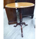 A late 19thC mahogany pedestal table, the oval top over a ring turned column,